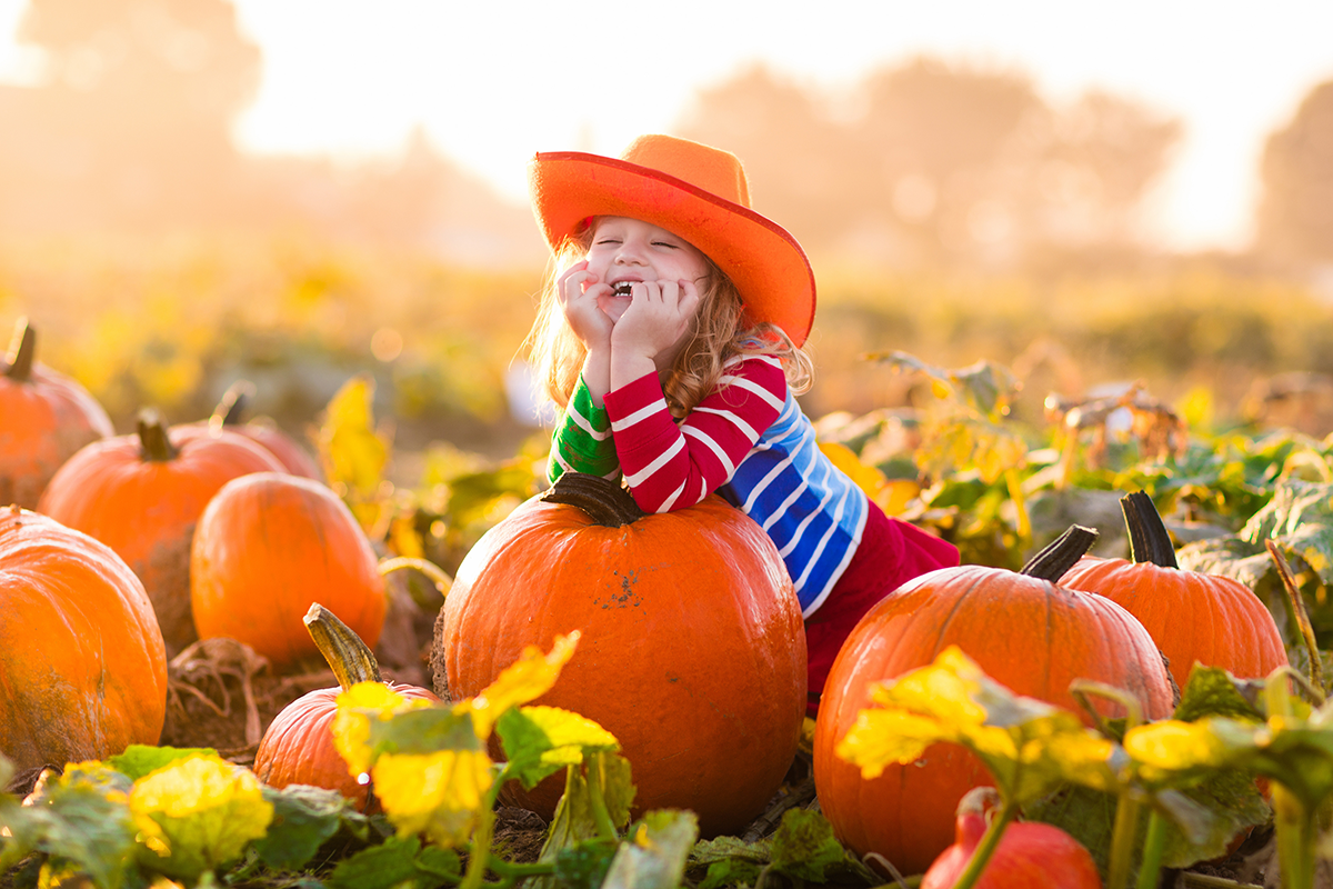 Girl in Pumpkin Patch