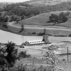 North Park Lake and Boathouse (1937). View of North Park Lake and boathouse looking east from North Ridge Drive. Also shown are Pearce Mill Road to the left and Lake Shore Drive on the right. The Rose Barn can also be seen on the left. Located in North Pa