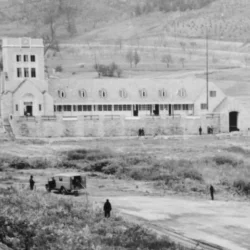 North Park Boathouse. View of North Park Boathouse from the rear, looking west across empty lakebed. Pearce Mill Road can be seen in the background. Barn visible in background on the right. Located in North Park, Allegheny County Park, Allegheny County, P